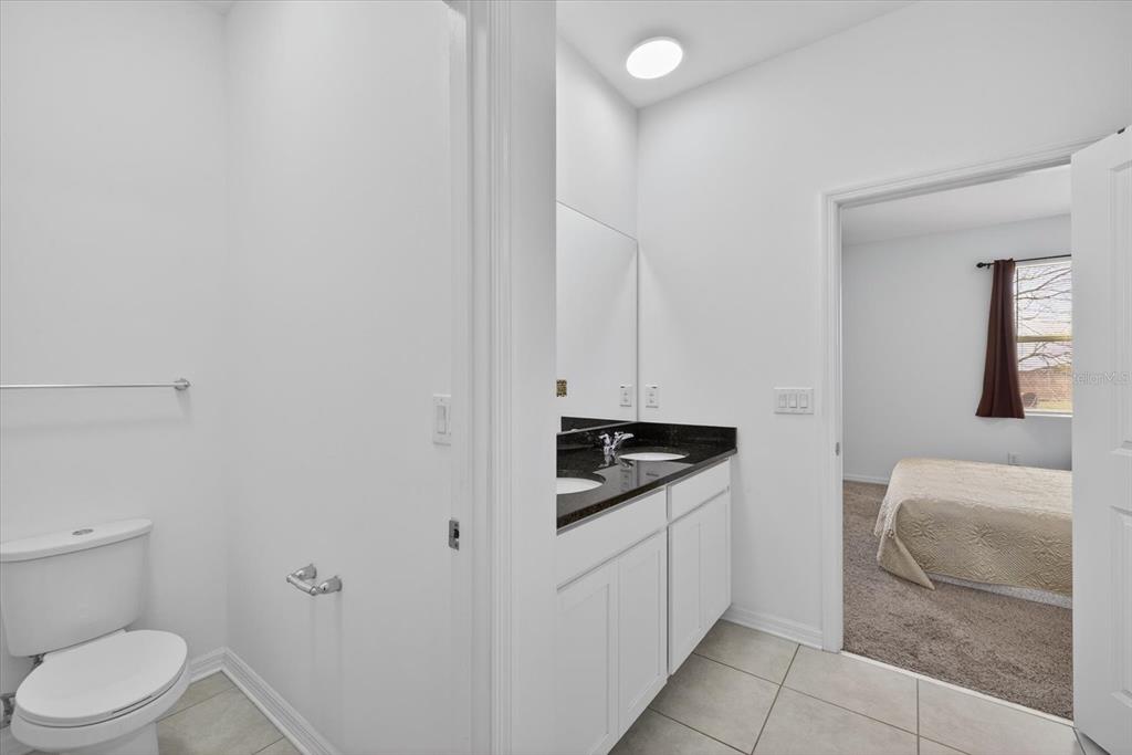 11883 Brighton Knoll Loop Riverview, FL 33579 - Photo 13 of 45 a spacious bathroom with a sink and a toilet