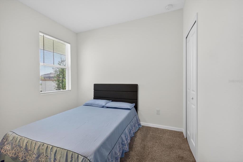 11883 Brighton Knoll Loop Riverview, FL 33579 - Photo 17 of 45 a bedroom with a bed and window