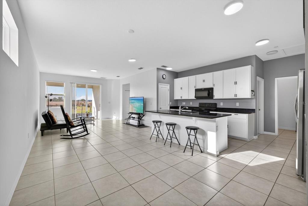 11883 Brighton Knoll Loop Riverview, FL 33579 - Photo 2 of 45 a kitchen with cabinets and chairs