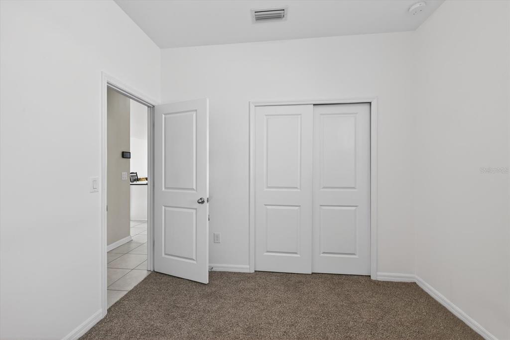 11883 Brighton Knoll Loop Riverview, FL 33579 - Photo 21 of 45 an empty room with closet area