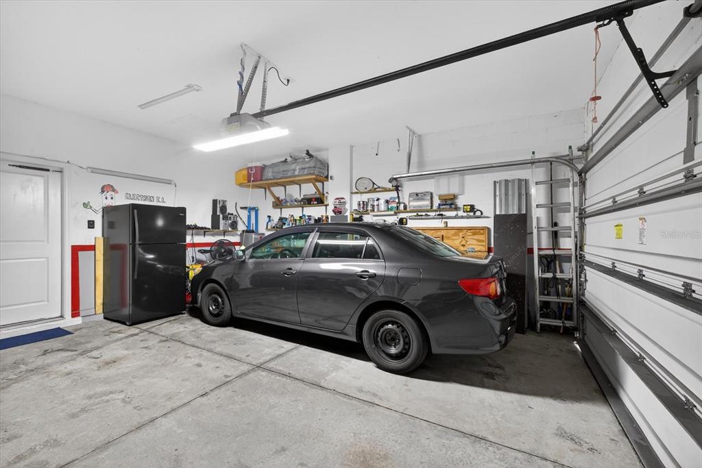 11883 Brighton Knoll Loop Riverview, FL 33579 - Photo 23 of 45 a car that is parked in a garage