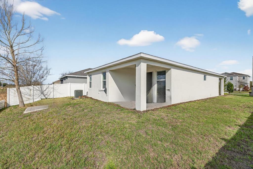 11883 Brighton Knoll Loop Riverview, FL 33579 - Photo 24 of 45 a view of a house with a yard