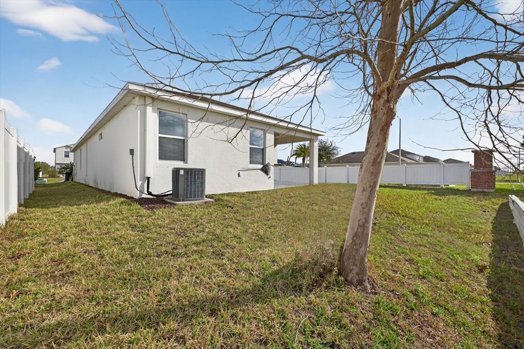 11883 Brighton Knoll Loop Riverview, FL 33579 - Photo 26 of 45 a view of a house with backyard and tree