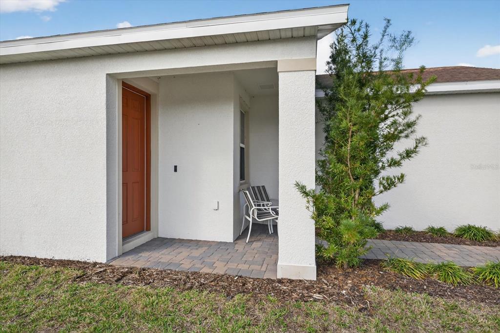 11883 Brighton Knoll Loop Riverview, FL 33579 - Photo 27 of 45 a view of entryway with a flower garden
