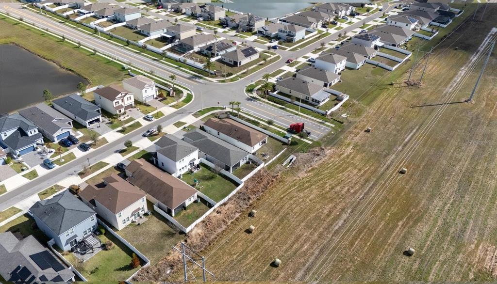11883 Brighton Knoll Loop Riverview, FL 33579 - Photo 38 of 45 an aerial view of a residential apartment building with parking space