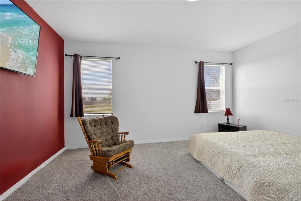 11883 Brighton Knoll Loop Riverview, FL 33579 - Photo 7 of 45 a bedroom with a bed and a window