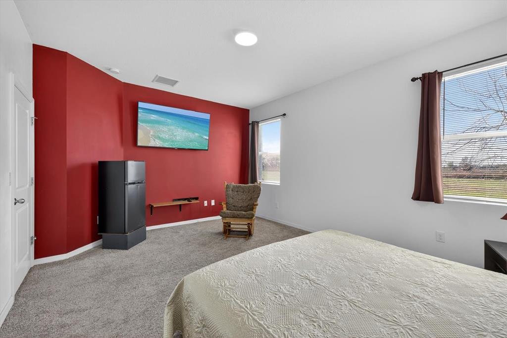 11883 Brighton Knoll Loop Riverview, FL 33579 - Photo 8 of 45 a bedroom with a bed and a window