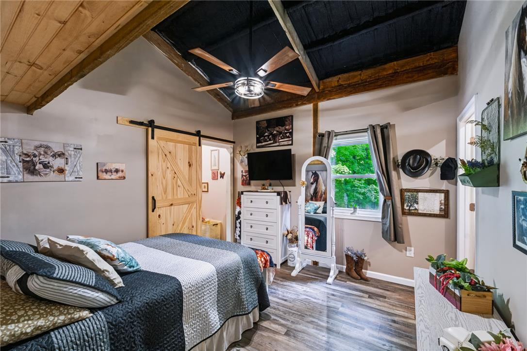 74 Turkey Road Kempton, PA 19529 - Photo 45 of 65 GUEST HOME - Exposed beams and a vaulted ceiling elevate this inviting bedroom space.