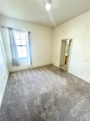 a kitchen with a refrigerator and a stove top oven