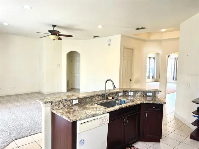 a view of a large pool with a yard