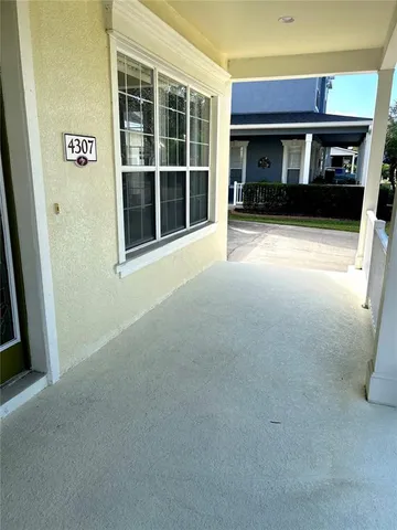 a view of empty room with windows