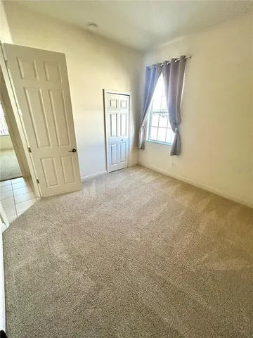 a bathroom with a granite countertop sink a toilet and a shower
