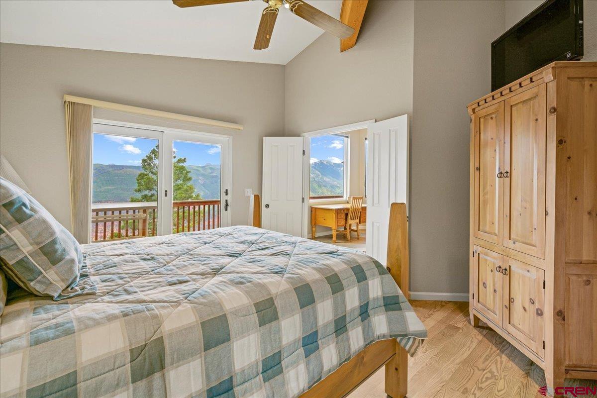 1600-2 Parcels) Elk Ridge Trail, Unit PARK ESTATES LOTS 4 AND 9 Ridgway, CO 81432 - Photo 13 of 39 a bedroom with a bed cabinets and a window