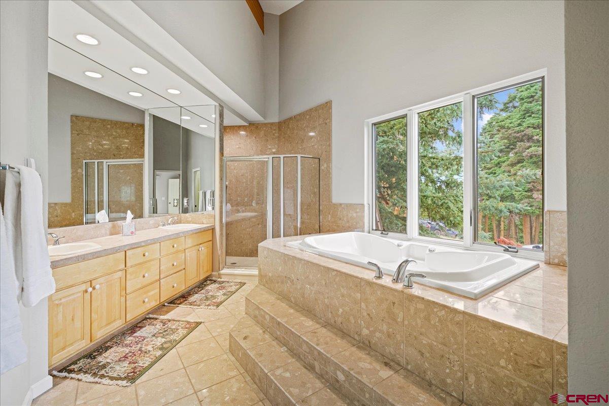 1600-2 Parcels) Elk Ridge Trail, Unit PARK ESTATES LOTS 4 AND 9 Ridgway, CO 81432 - Photo 14 of 39 a spacious bathroom with sink shower and bathtub
