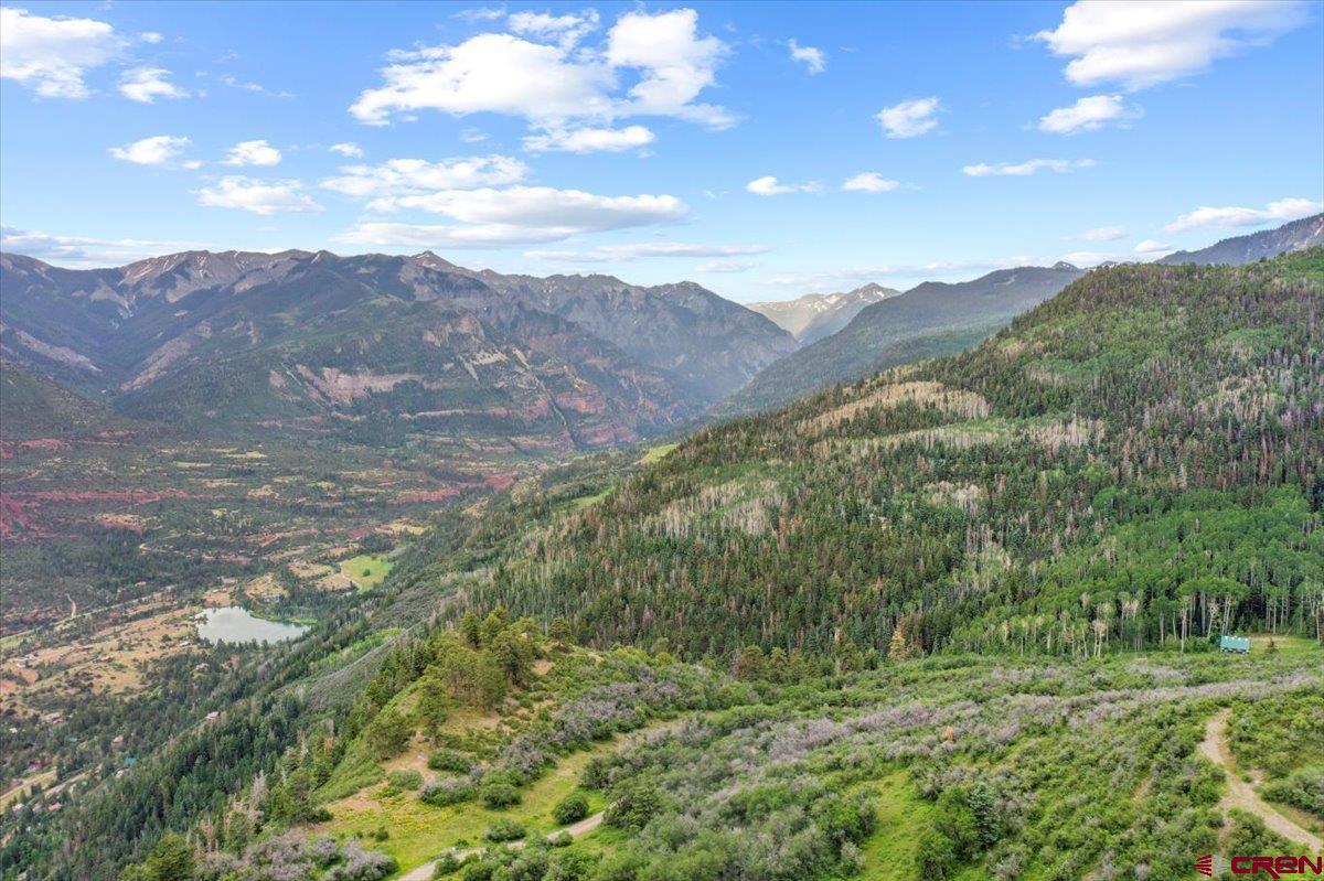 1600-2 Parcels) Elk Ridge Trail, Unit PARK ESTATES LOTS 4 AND 9 Ridgway, CO 81432 - Photo 18 of 39 a view of a lush green forest with mountains in the background