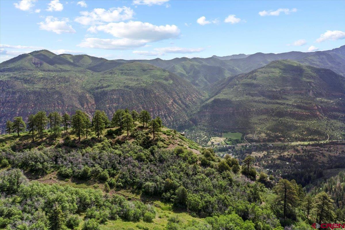 1600-2 Parcels) Elk Ridge Trail, Unit PARK ESTATES LOTS 4 AND 9 Ridgway, CO 81432 - Photo 19 of 39 a view of a houses with a lush green hillside