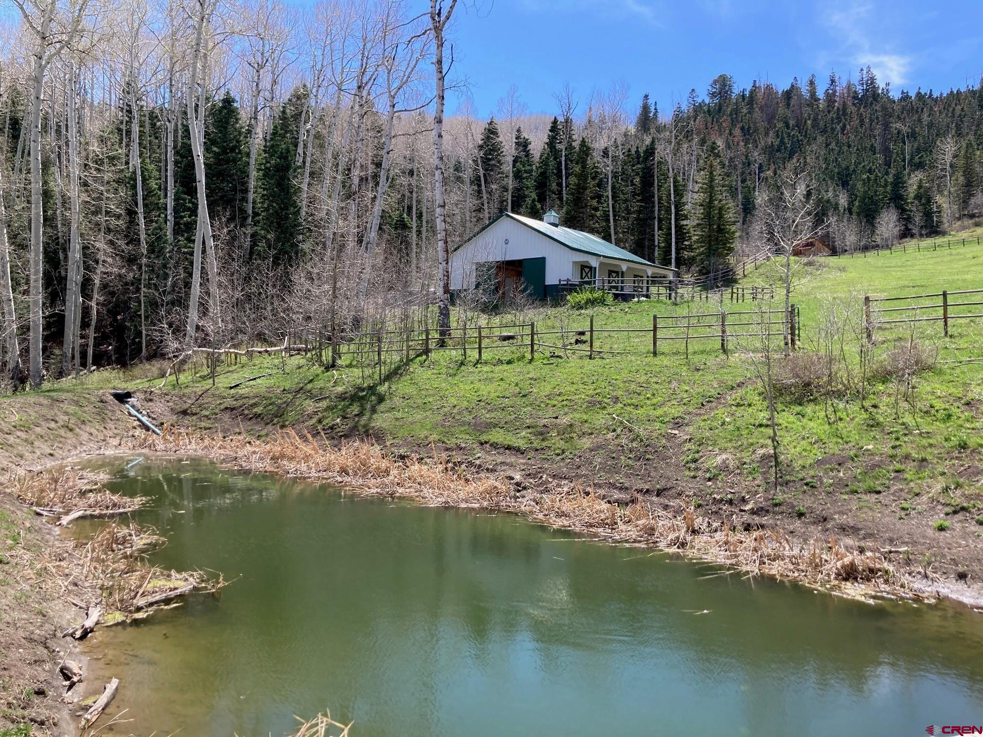 1600-2 Parcels) Elk Ridge Trail, Unit PARK ESTATES LOTS 4 AND 9 Ridgway, CO 81432 - Photo 26 of 39 a backyard of a house with lots of green space