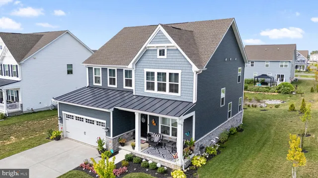 a aerial view of a house with a yard