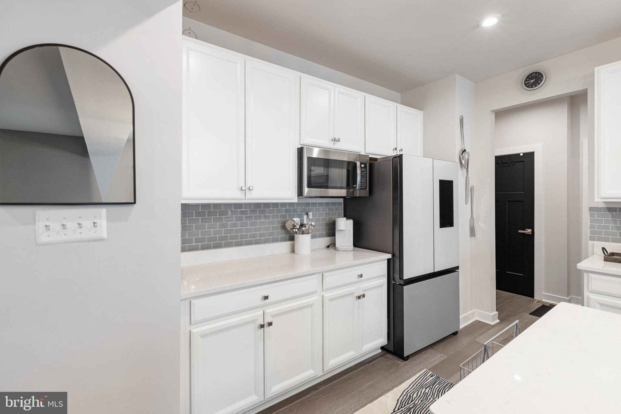 300 Jasper Way Middletown, DE 19709 - Photo 13 of 34 a kitchen with a refrigerator sink and cabinets