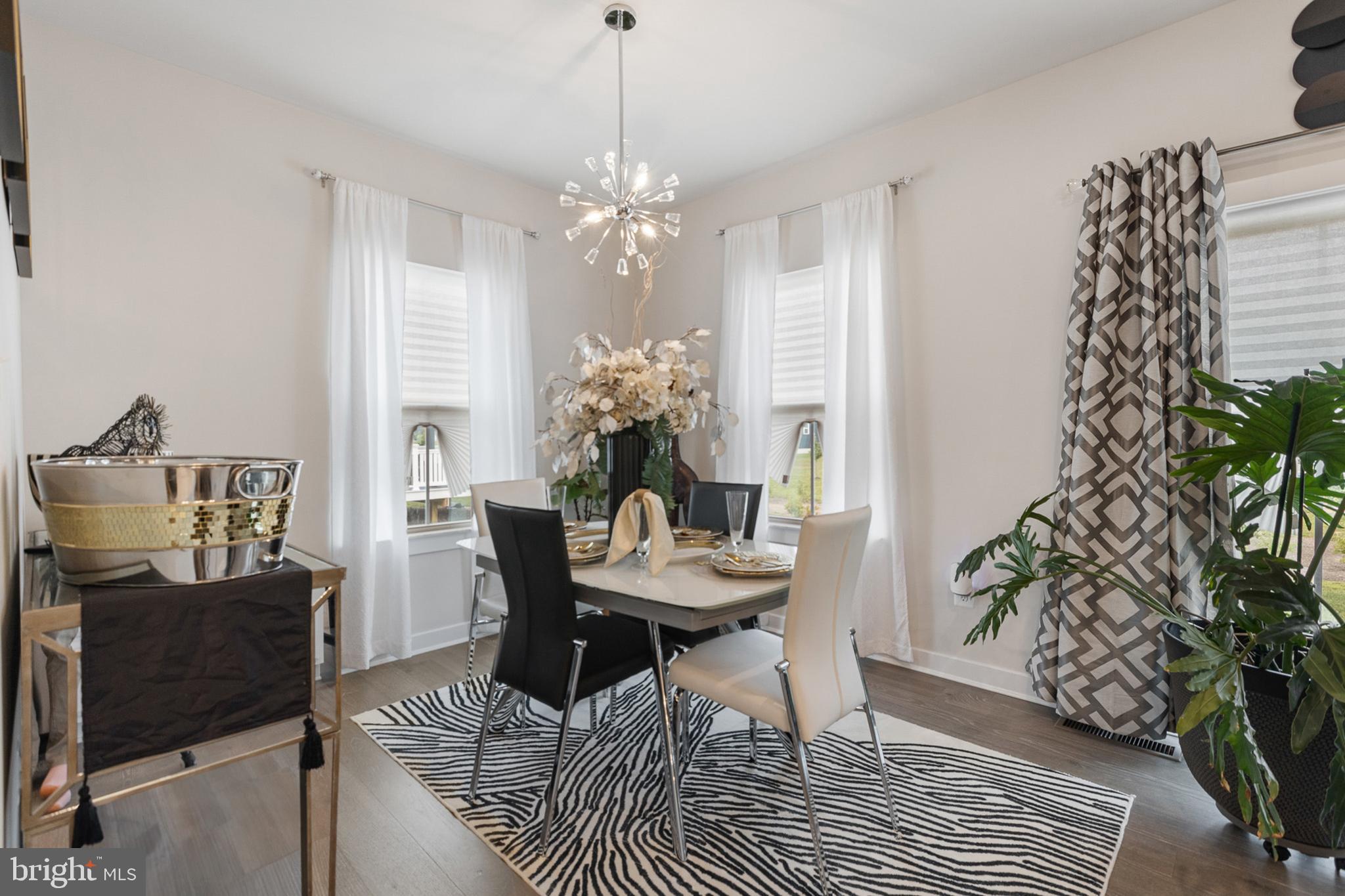 300 Jasper Way Middletown, DE 19709 - Photo 15 of 34 a view of a dining room with furniture and chandelier