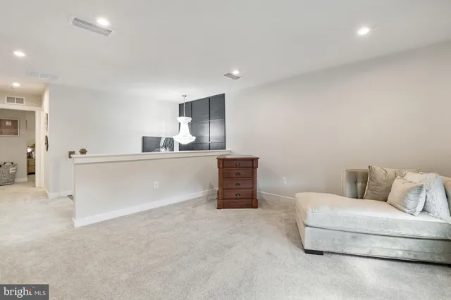 a living room with furniture and a couch