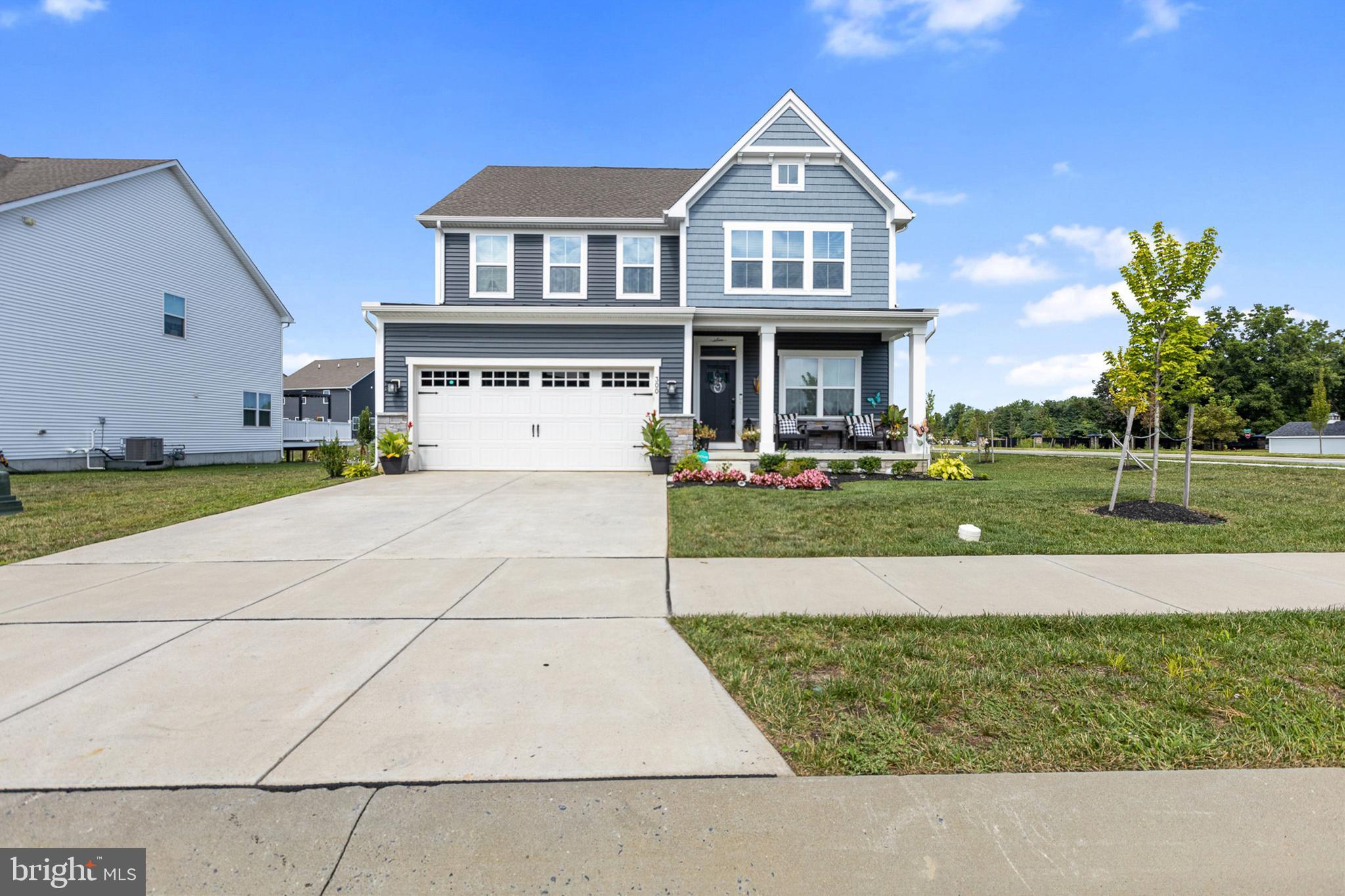 300 Jasper Way Middletown, DE 19709 - Photo 2 of 34 a front view of a house with a yard