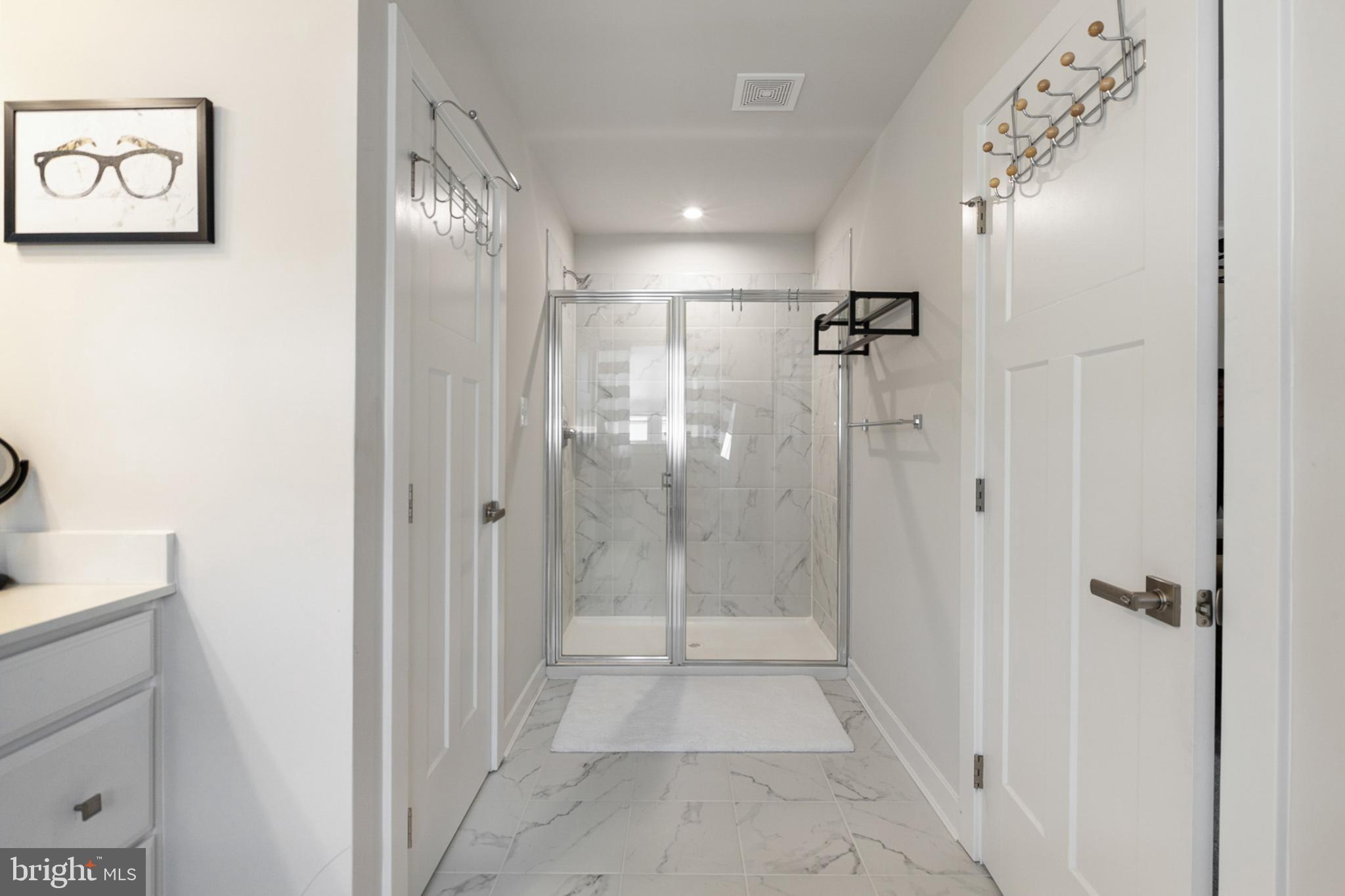 300 Jasper Way Middletown, DE 19709 - Photo 24 of 34 a bathroom with a glass shower door