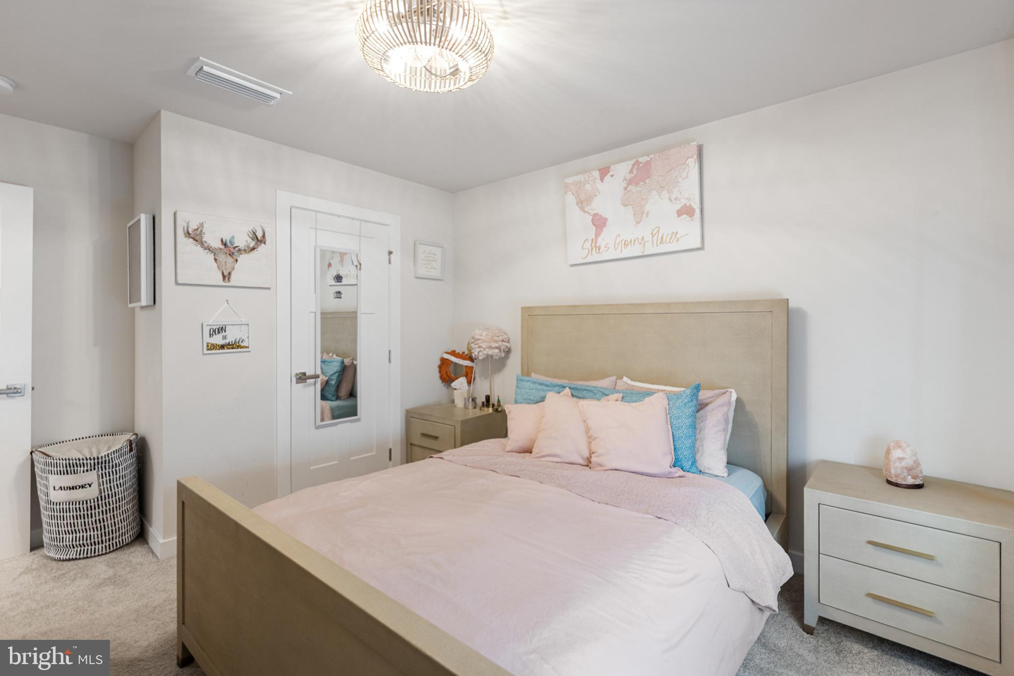 300 Jasper Way Middletown, DE 19709 - Photo 25 of 34 a bedroom with a bed and a chandelier