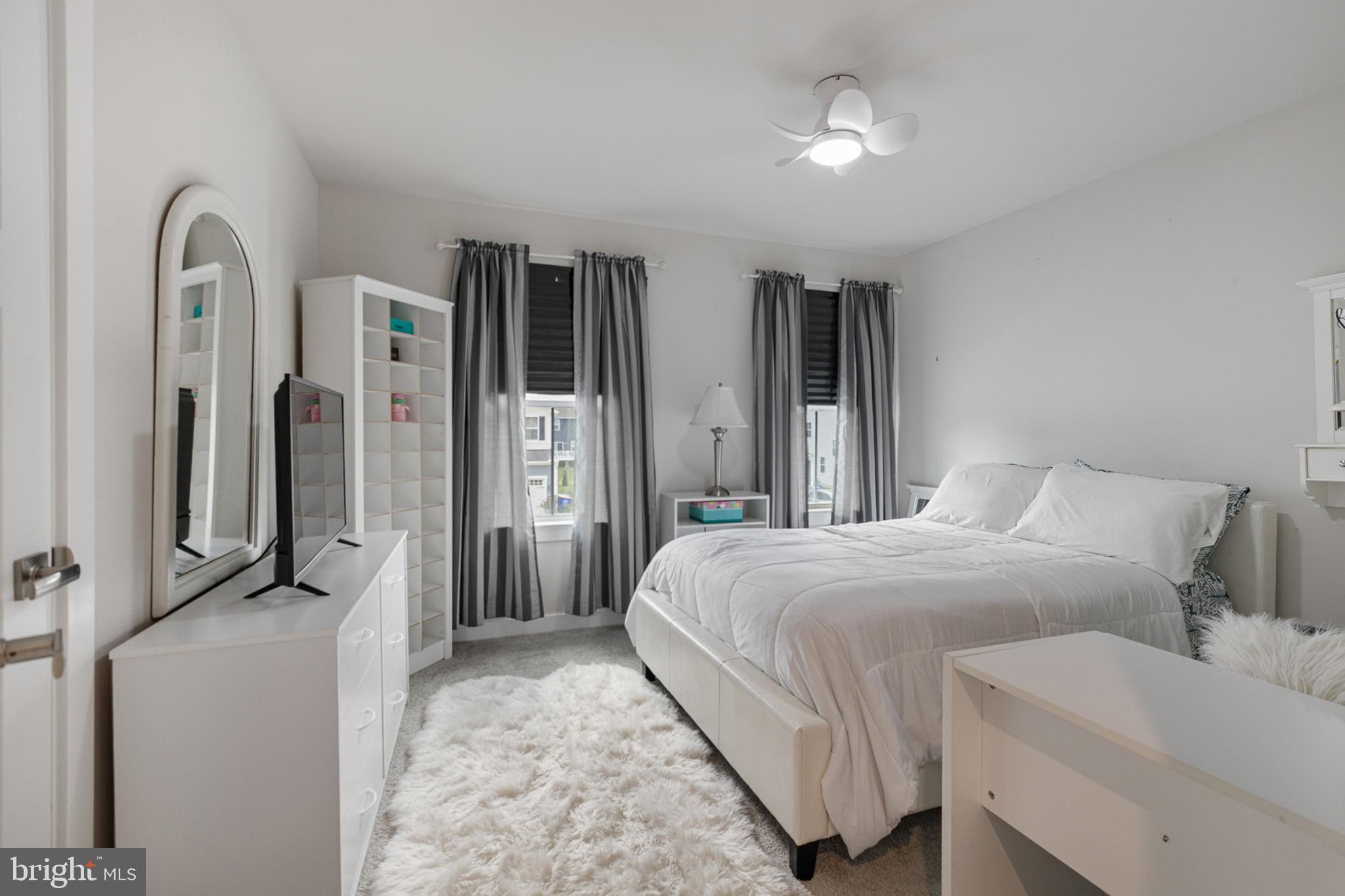 300 Jasper Way Middletown, DE 19709 - Photo 28 of 34 a bedroom with a bed and a chandelier