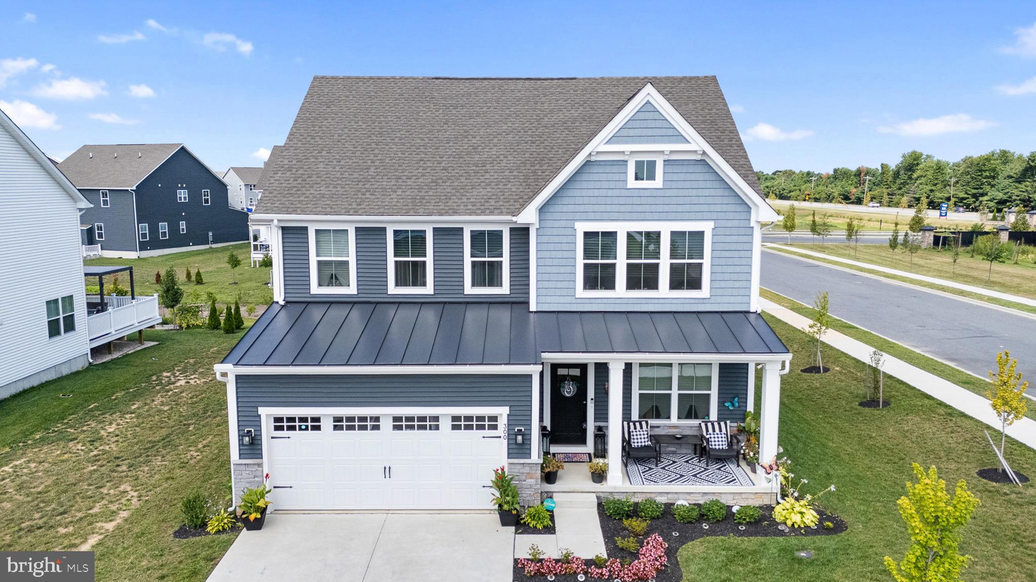 300 Jasper Way Middletown, DE 19709 - Photo 3 of 34 front view of a house with a yard