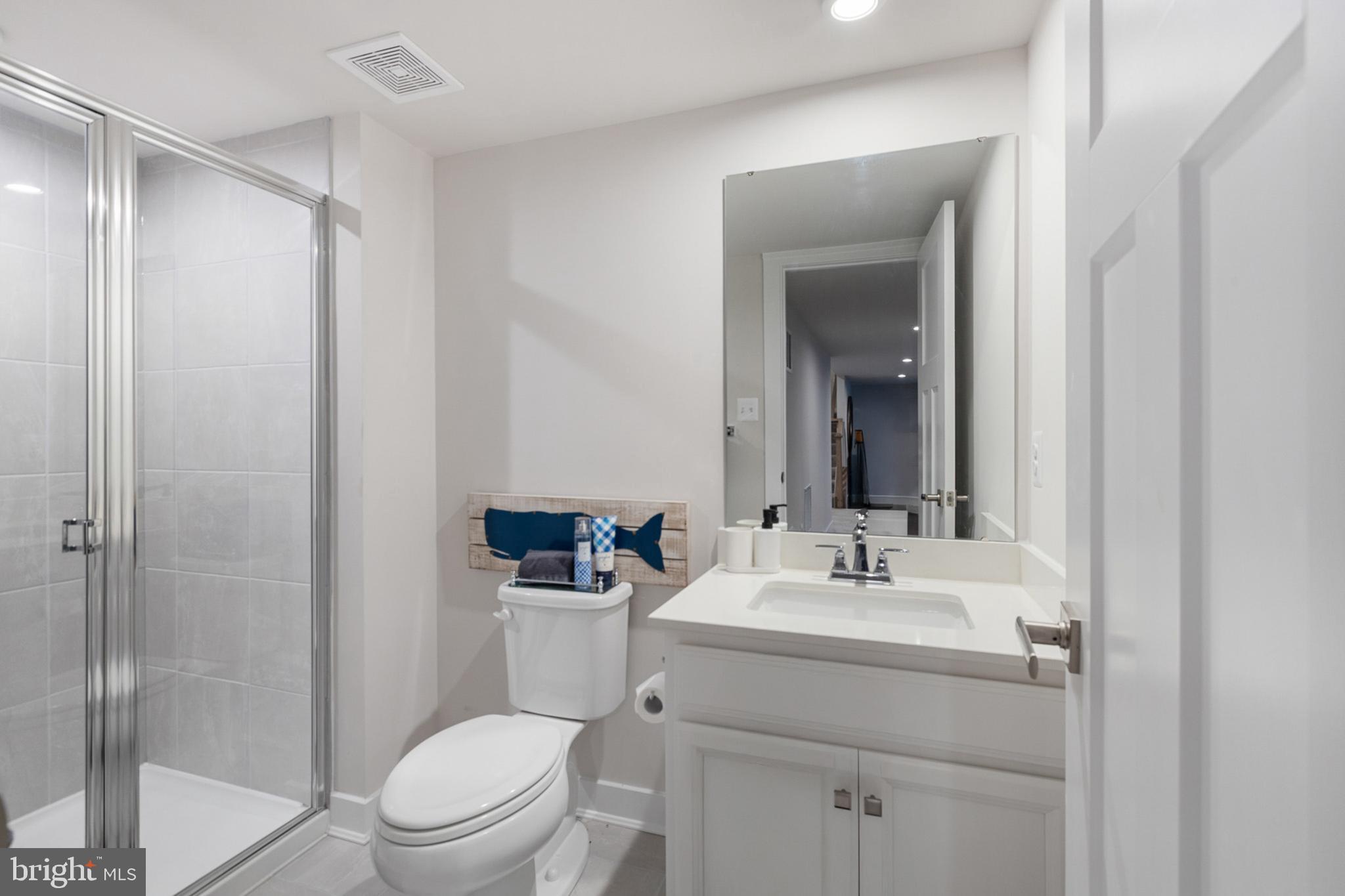 300 Jasper Way Middletown, DE 19709 - Photo 32 of 34 a bathroom with a toilet a sink and a mirror
