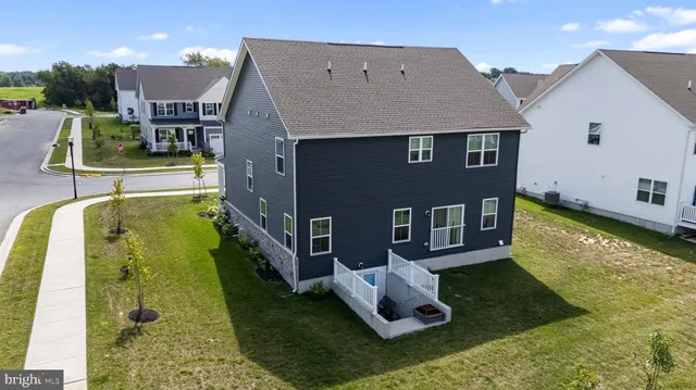 a aerial view of a house with swimming pool