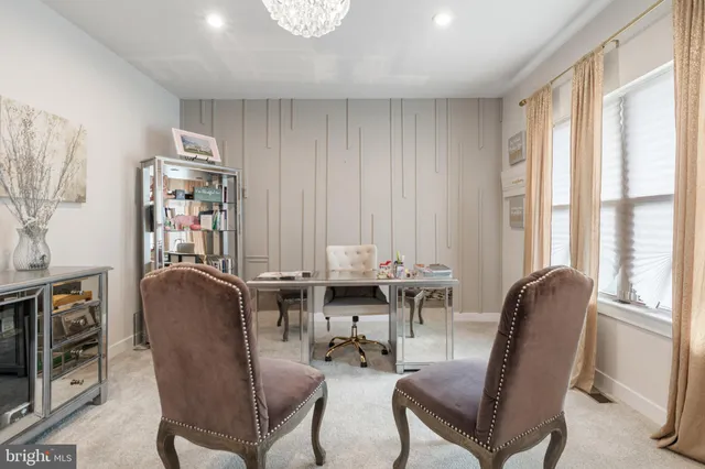 a view of a livingroom with furniture window and a chair