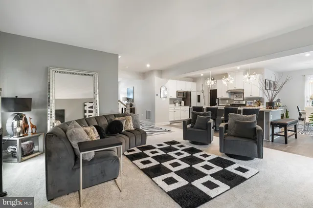 a living room with furniture and a rug