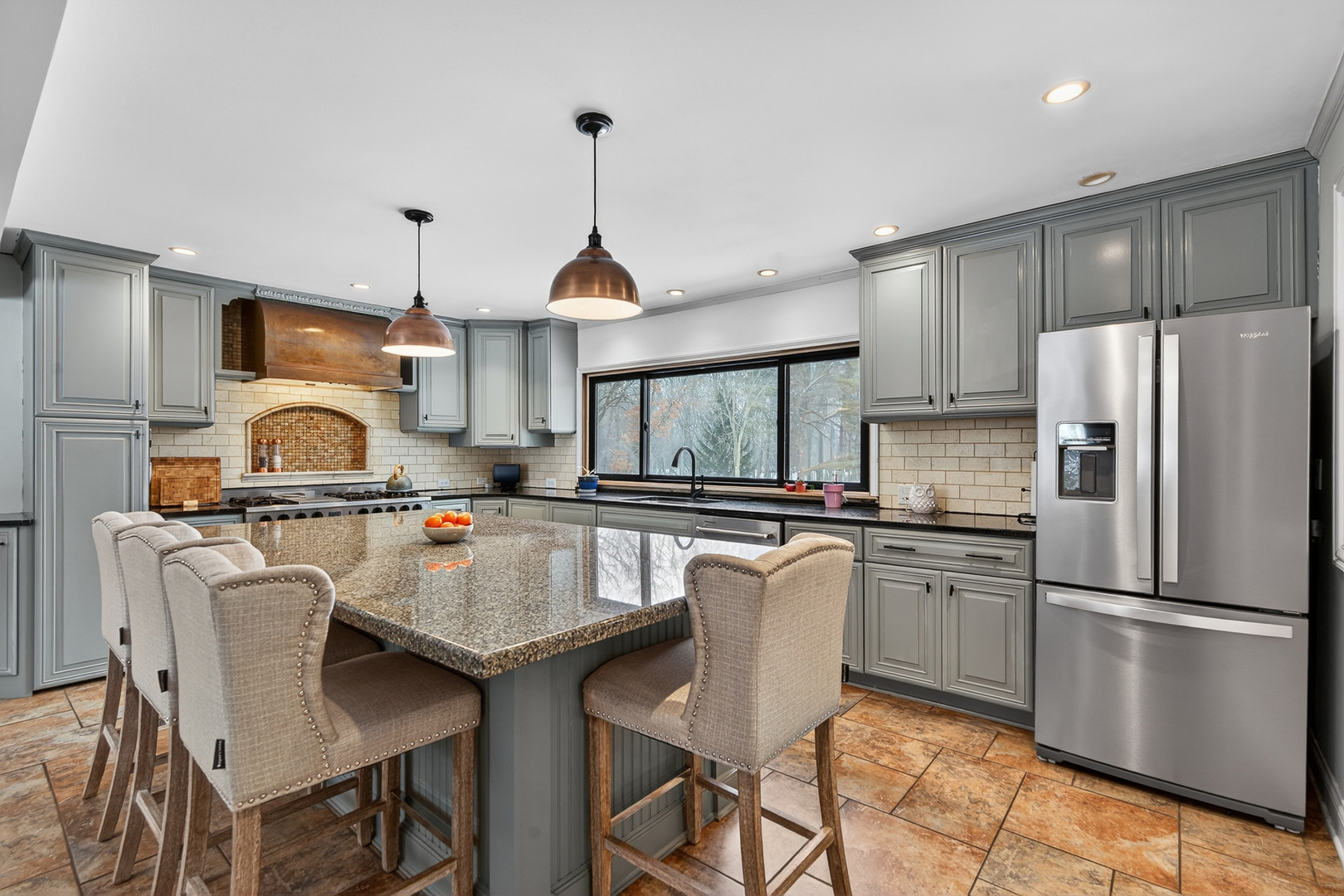 1275 Country Club Road Lake Zurich, IL 60047 - Photo 9 of 49 a kitchen with stainless steel appliances granite countertop a sink a stove a refrigerator cabinets and chairs
