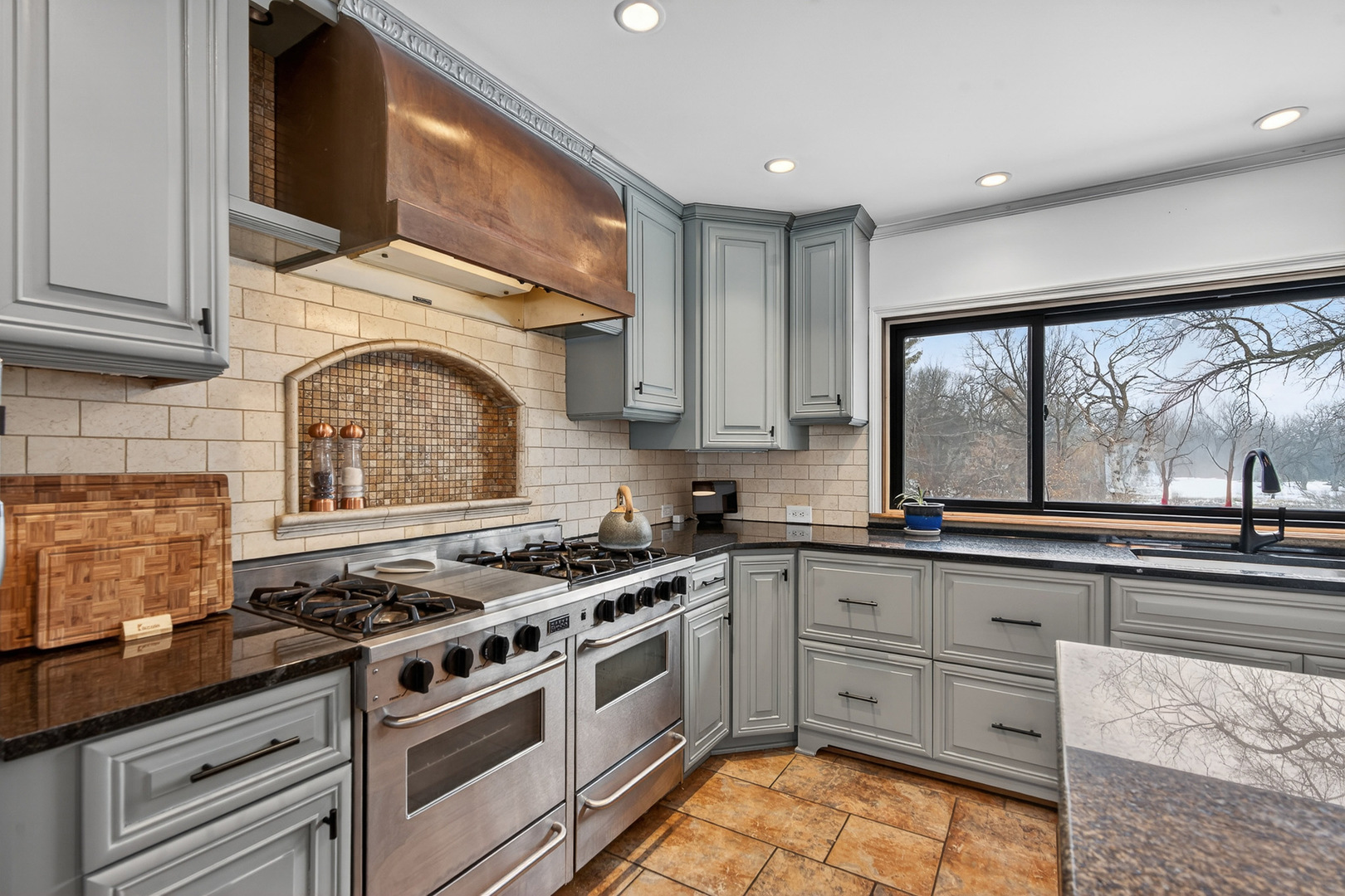 1275 Country Club Road Lake Zurich, IL 60047 - Photo 10 of 49 a kitchen with stainless steel appliances granite countertop a stove a sink and a microwave