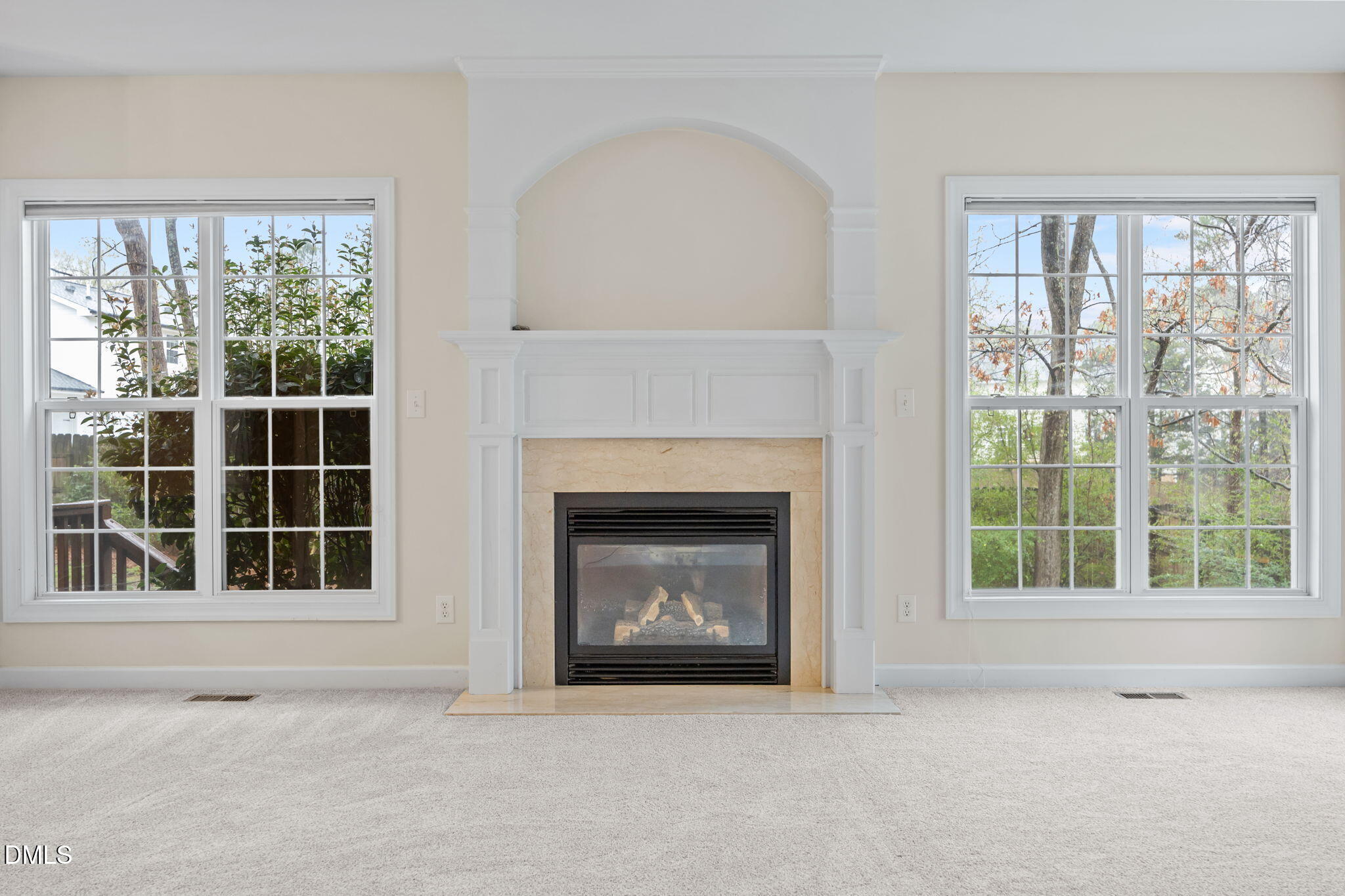 7 Bobcat Court Durham, NC 27713 - Photo 11 of 64 a view of an empty room with a window and fireplace
