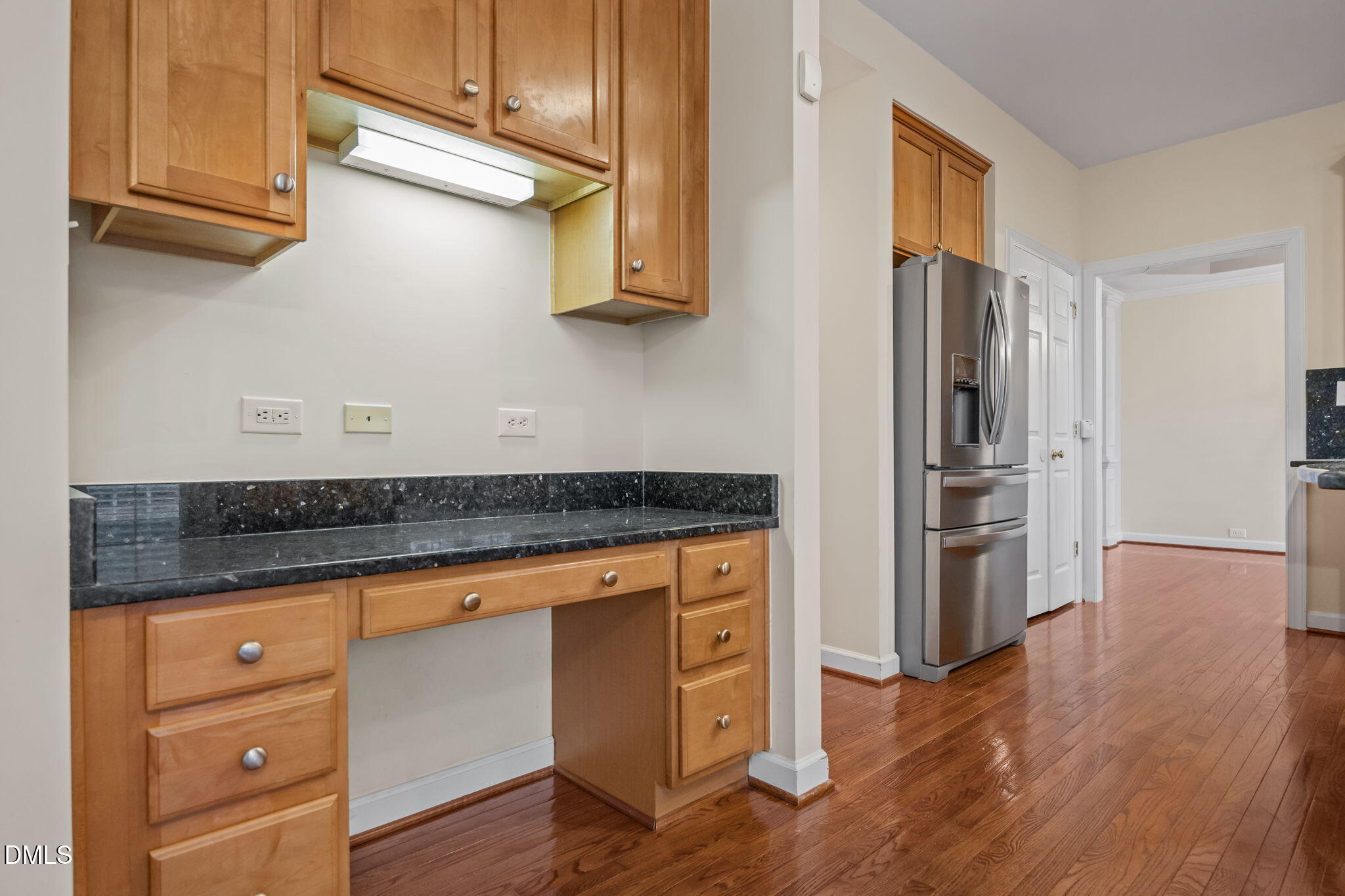 7 Bobcat Court Durham, NC 27713 - Photo 15 of 64 a kitchen with granite countertop a refrigerator and wooden floor