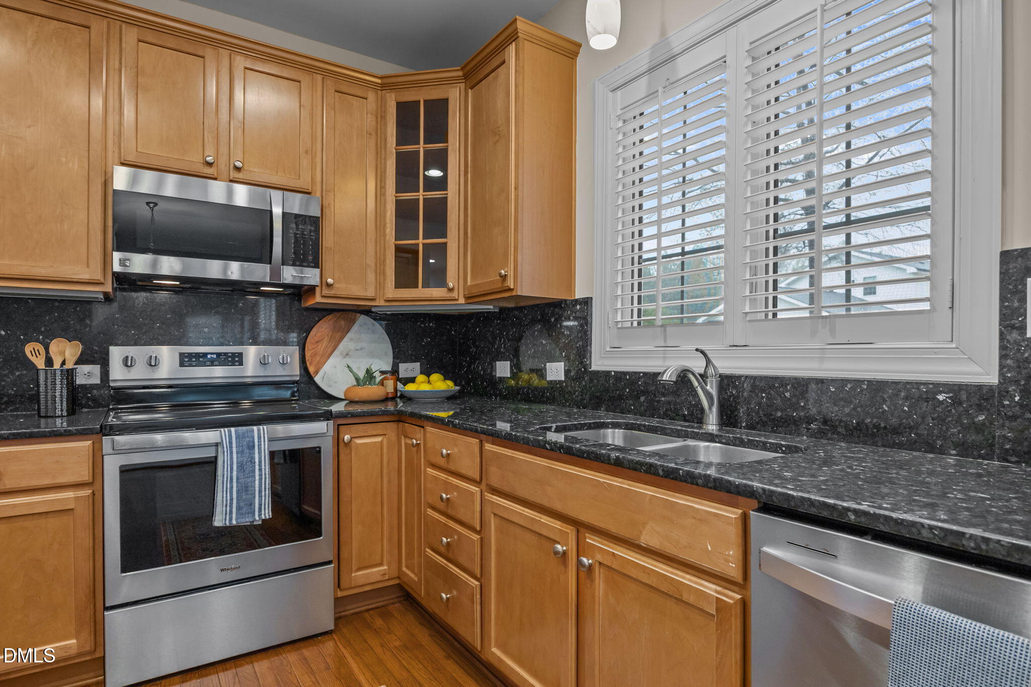 7 Bobcat Court Durham, NC 27713 - Photo 18 of 64 a kitchen with granite countertop cabinets stainless steel appliances and a sink