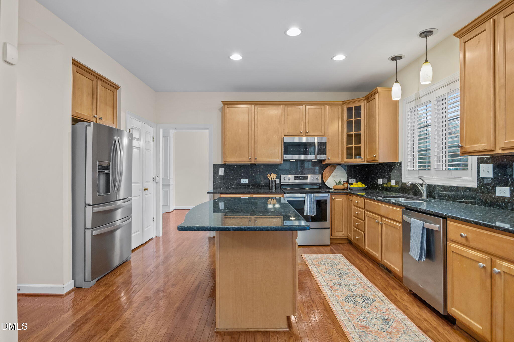 7 Bobcat Court Durham, NC 27713 - Photo 19 of 64 a large kitchen with stainless steel appliances and a refrigerator