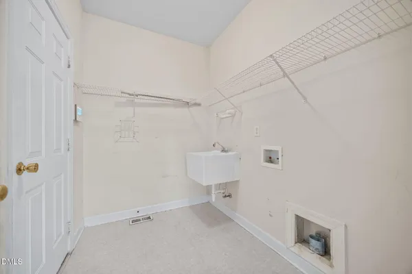 a view of a room with white walls