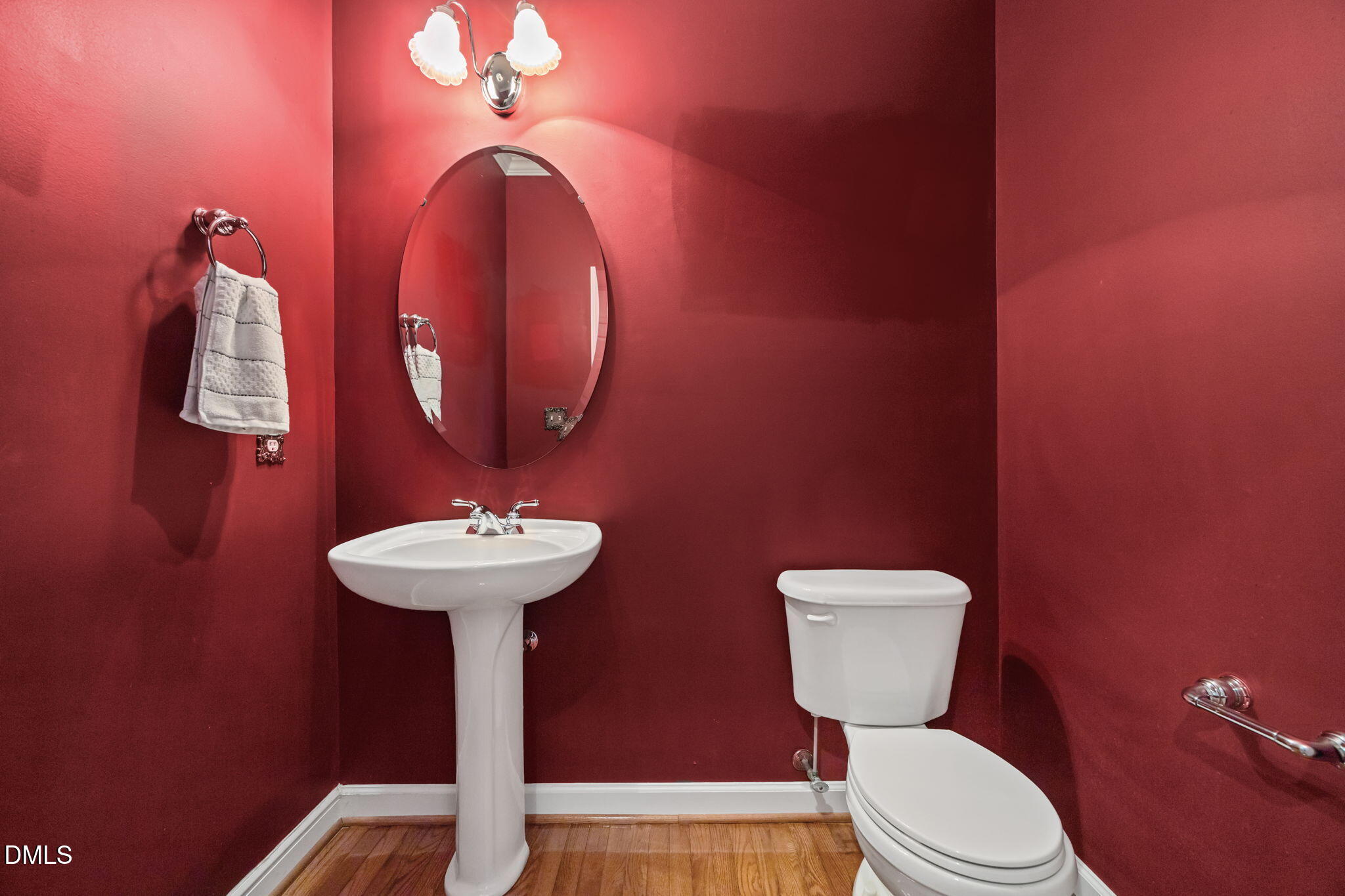 7 Bobcat Court Durham, NC 27713 - Photo 23 of 64 a bathroom with a toilet a sink and mirror