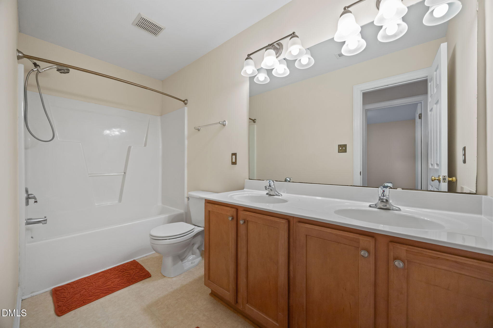 7 Bobcat Court Durham, NC 27713 - Photo 30 of 64 a bathroom with a sink a toilet and a large mirror