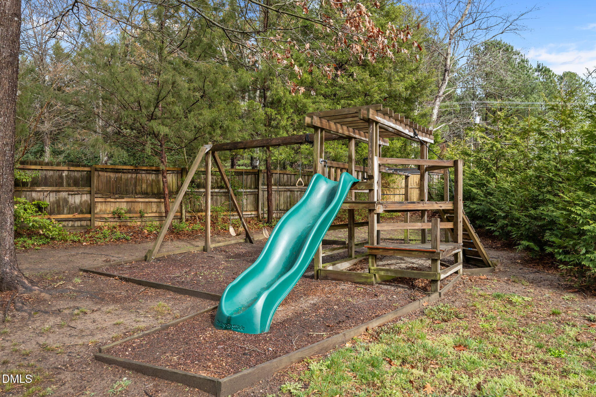7 Bobcat Court Durham, NC 27713 - Photo 47 of 64 a view of a backyard with a slide