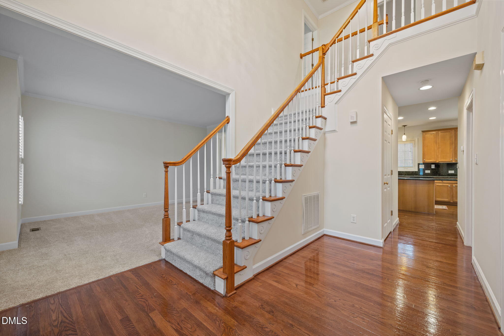 7 Bobcat Court Durham, NC 27713 - Photo 3 of 64 a view of entryway with wooden floor and stairs