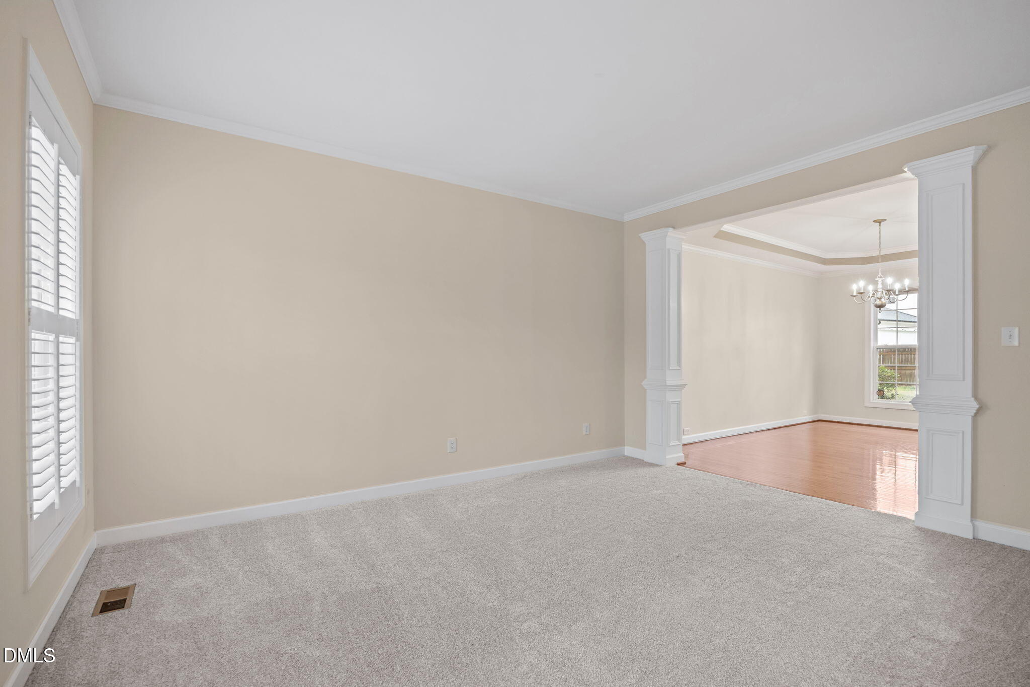 7 Bobcat Court Durham, NC 27713 - Photo 7 of 64 a view of empty room with wooden floor