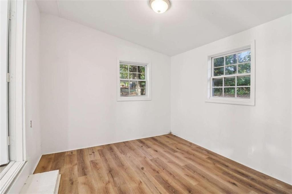 9202 Settlers Grove Road Northeast Covington, GA 30014 - Photo 18 of 45 an empty room with a window