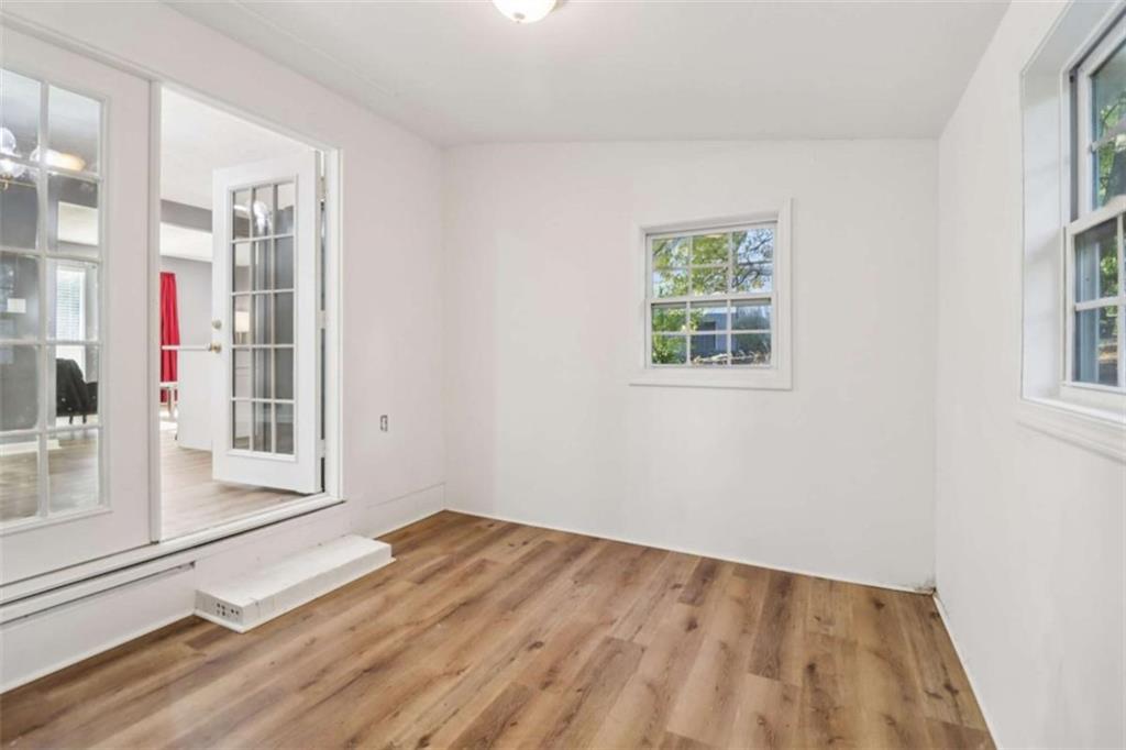 9202 Settlers Grove Road Northeast Covington, GA 30014 - Photo 19 of 45 an empty room with windows