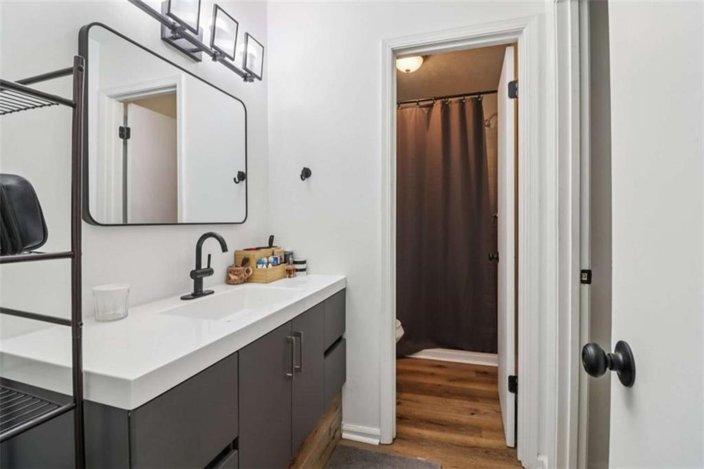 9202 Settlers Grove Road Northeast Covington, GA 30014 - Photo 21 of 45 a bathroom with a sink and a mirror