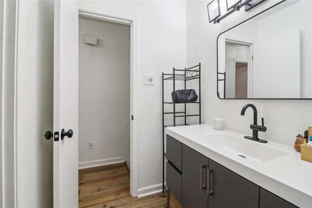 9202 Settlers Grove Road Northeast Covington, GA 30014 - Photo 23 of 45 a bathroom with a sink and a mirror